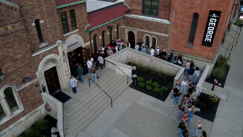 The George in Cincinnati, with guests arriving on the front steps